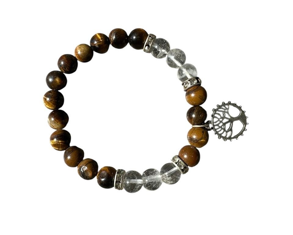 Beaded bracelet with tree of life charm on a white background